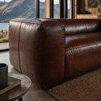 Cardrona Leather Sofa in rich brown leather with deep seating, set in a mountain-view living room.