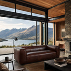 Cardrona Leather Sofa with generous proportions and deep seating in rich leather in a modern mountain-view living room.