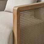 Solid ash wood frame and woven rattan panel detail on the Aro Swivel Armchair with soft linen-look upholstery.