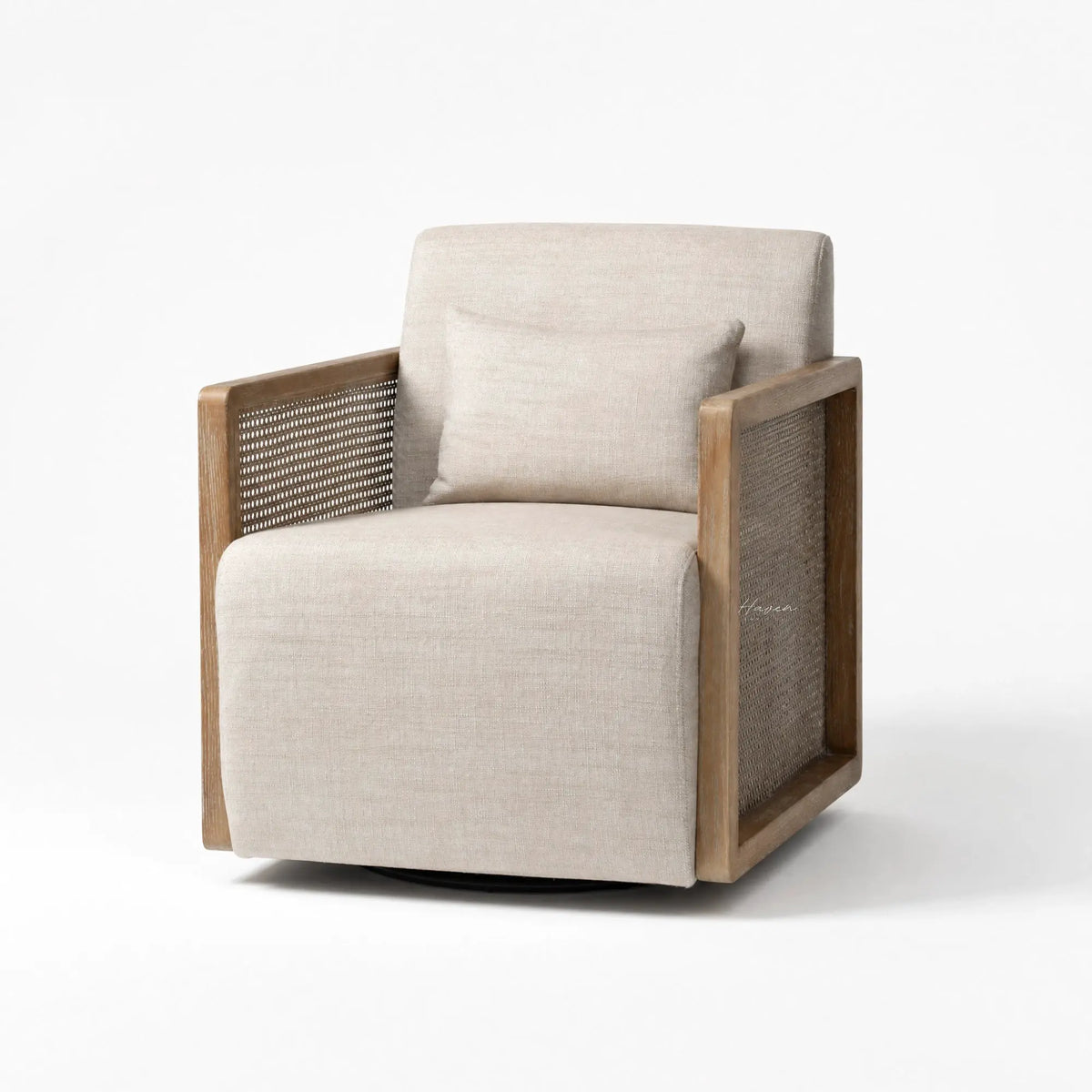 Aro swivel armchair with solid ash wood frame, woven rattan sides, and beige linen upholstery including a matching lumbar pillow.