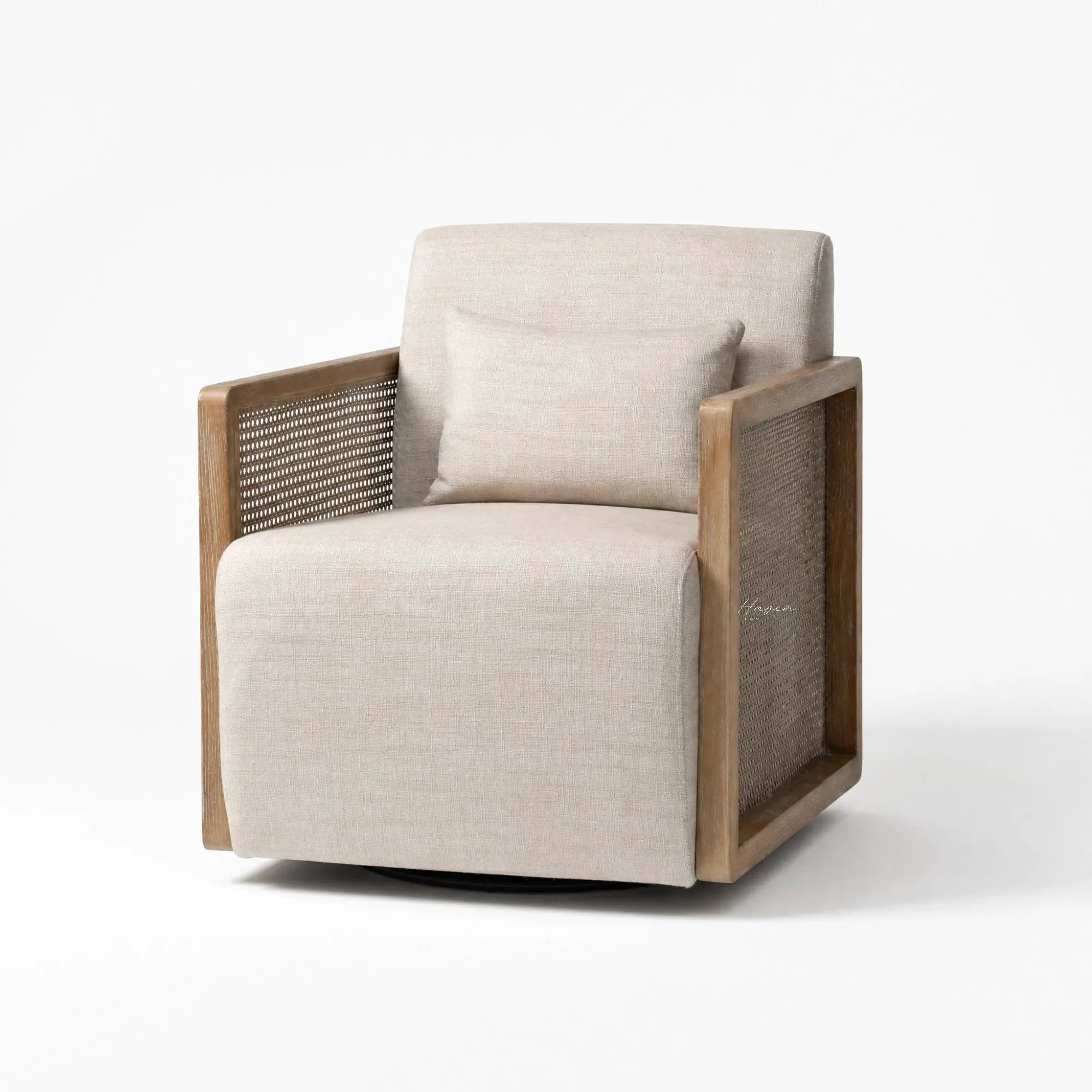 Aro swivel armchair with solid ash wood frame, woven rattan sides, and beige linen upholstery including a matching lumbar pillow.