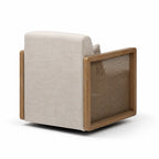 Rear view of a swivel armchair featuring solid ash wood frames, woven rattan side panels, and soft linen-look upholstery in a neutral tone.