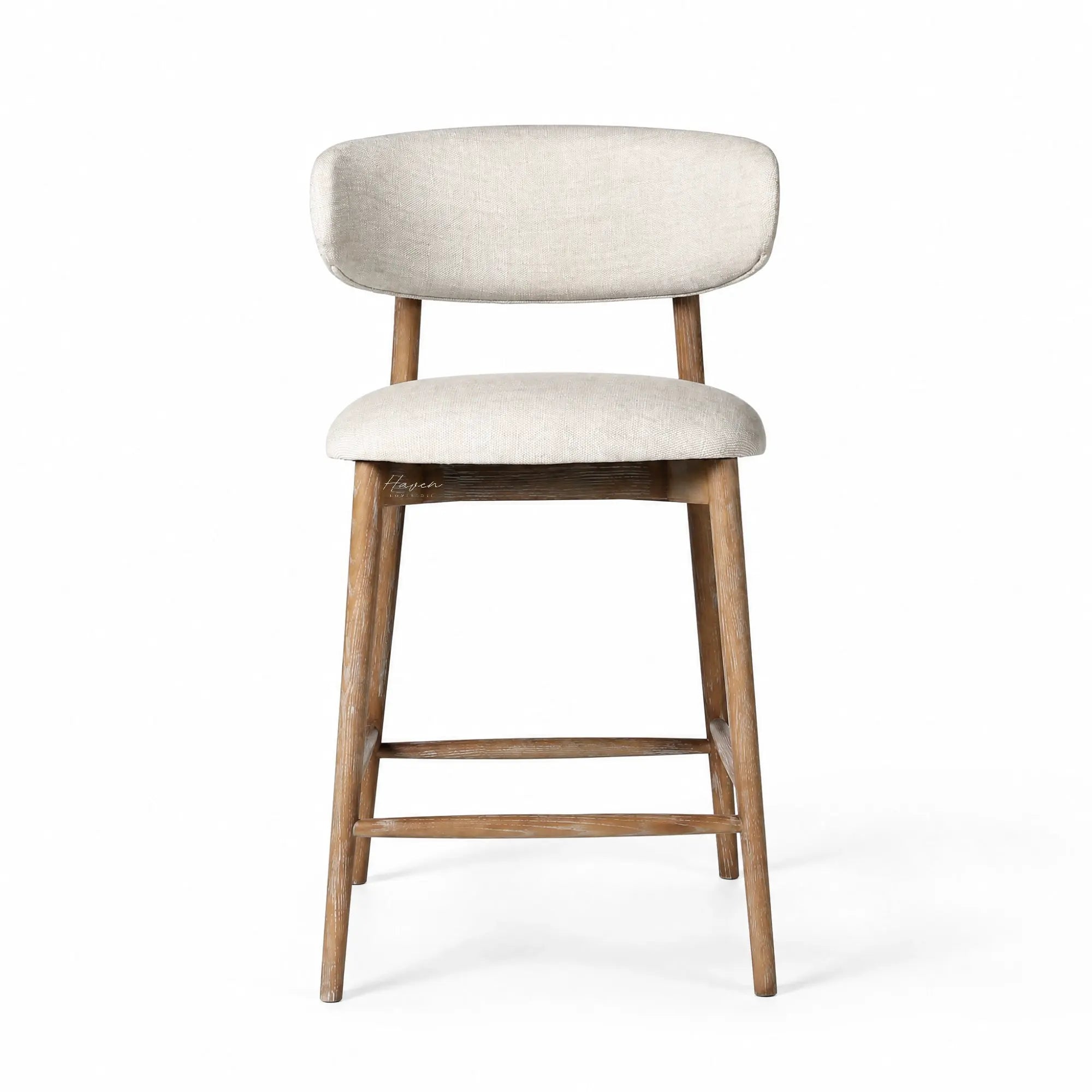 Aren counter stool with solid ash frame and soft beige polyester upholstery, offering relaxed comfort for kitchen or living spaces.