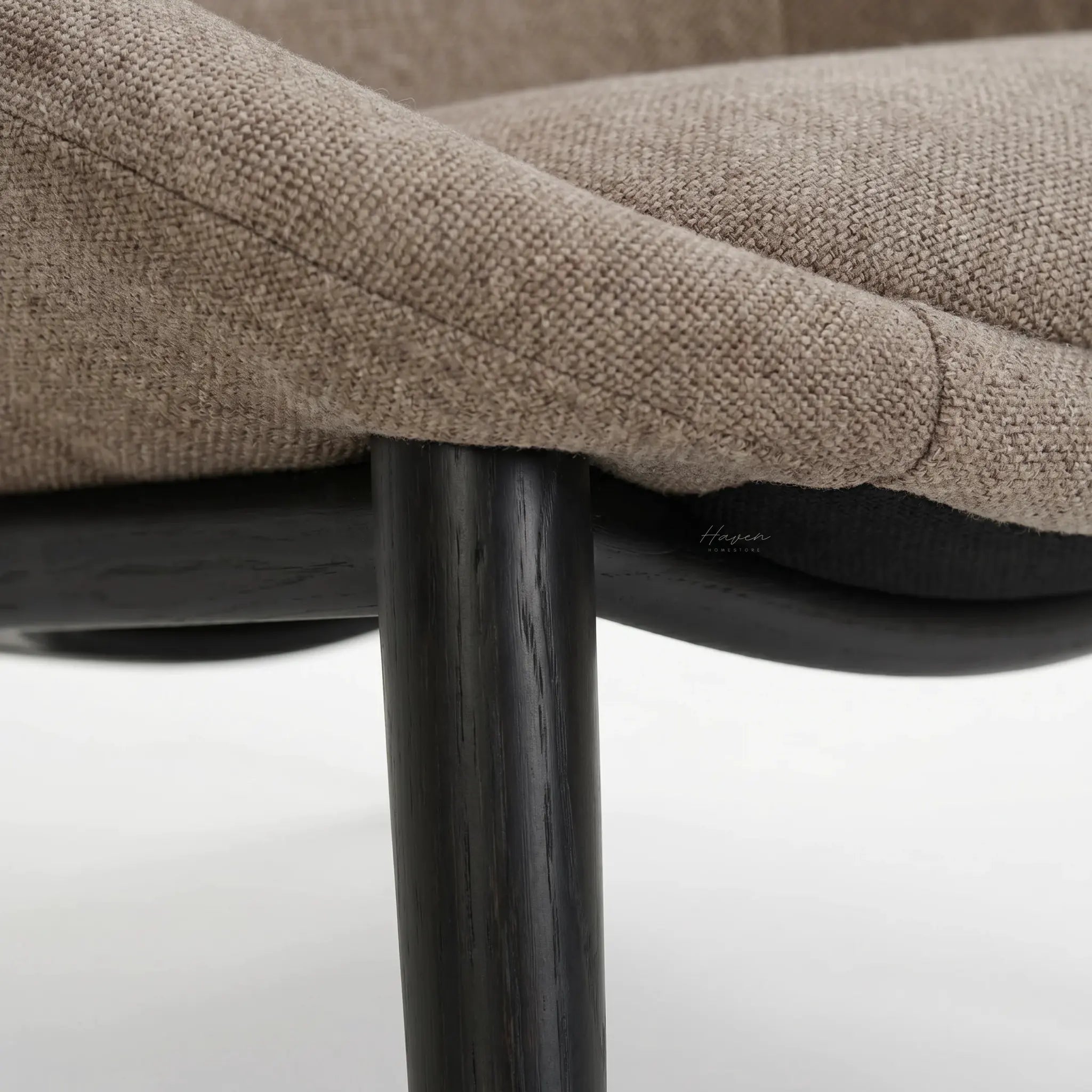 Pierre Chair latte upholstery in textured polyester fabric with dark wooden legs.