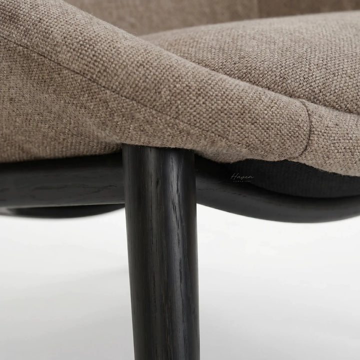 Pierre Chair latte upholstery in textured polyester fabric with dark wooden legs.