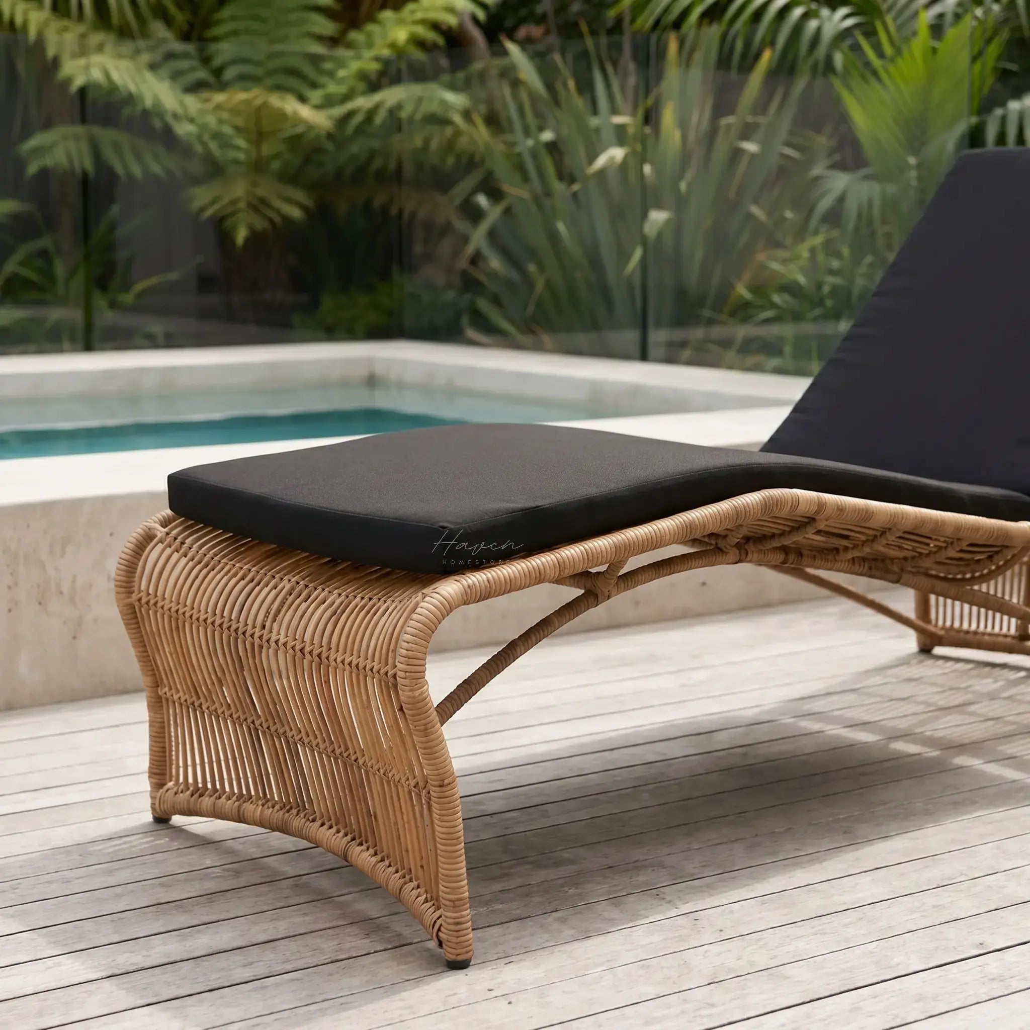 Wave Sun Lounger with UV-stabilised fibres over aluminium frame, black cushion on poolside deck.
