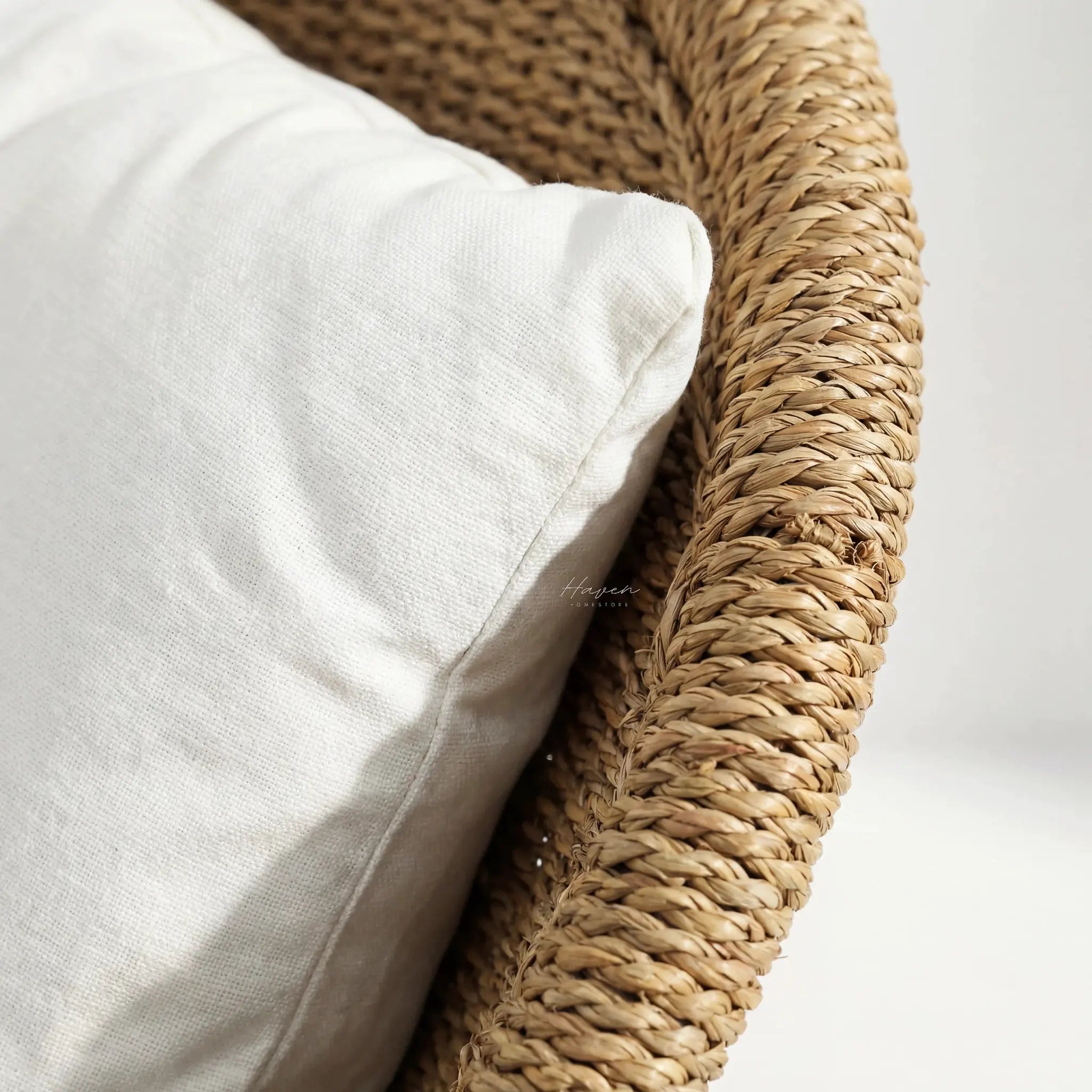 Scoop Chair with handwoven water hyacinth rope, seat and back cushions.