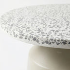 Broste Agari Table with terrazzo top and powder-coated iron base.