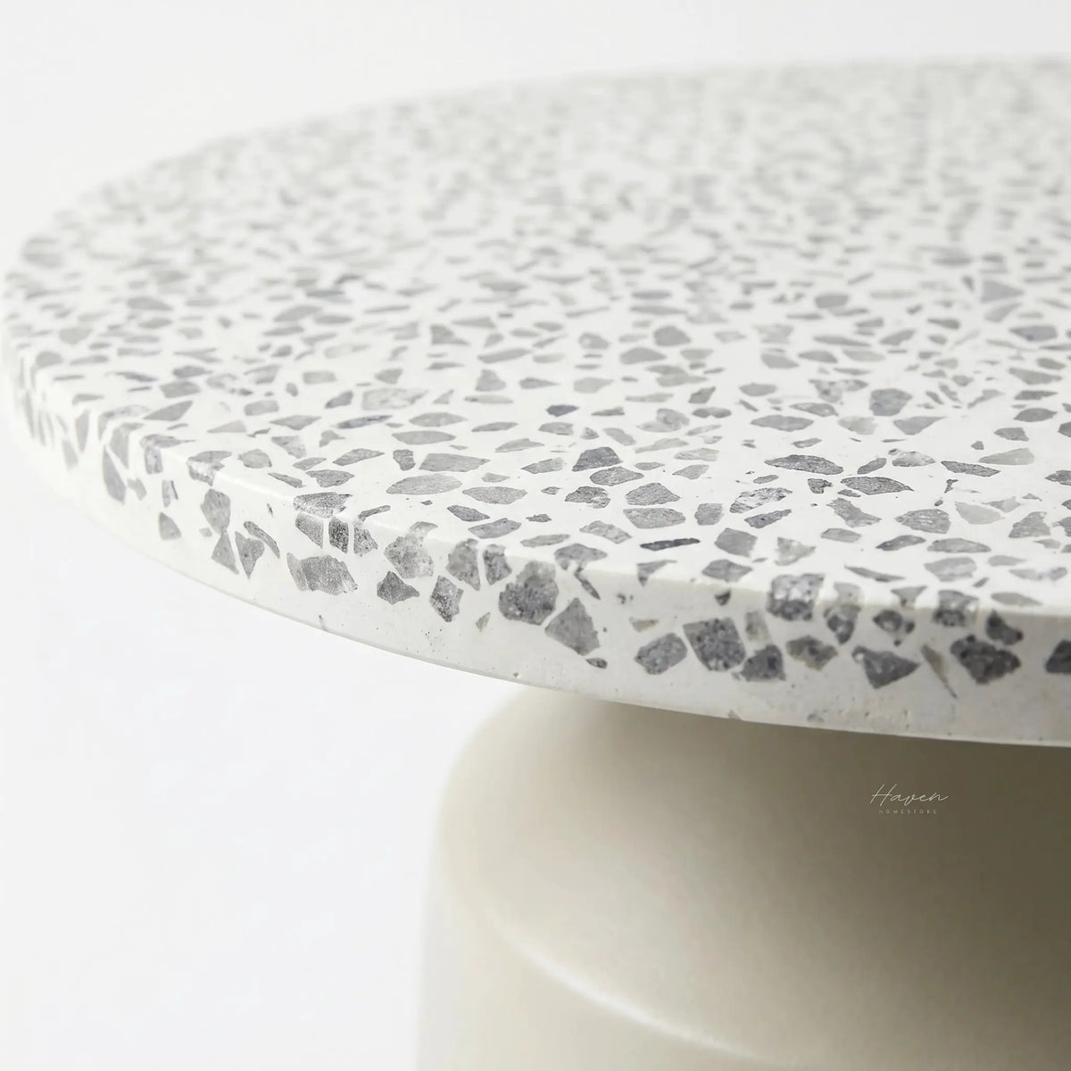 Broste Agari Table with terrazzo top and powder-coated iron base.