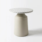 Broste Table Agari - Terrazzo: round terrazzo top with speckled surface on a smooth powder-coated iron base.