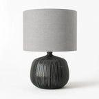 Aksel Table Lamp in Slate with a ribbed ceramic base and linen shade, grey-toned